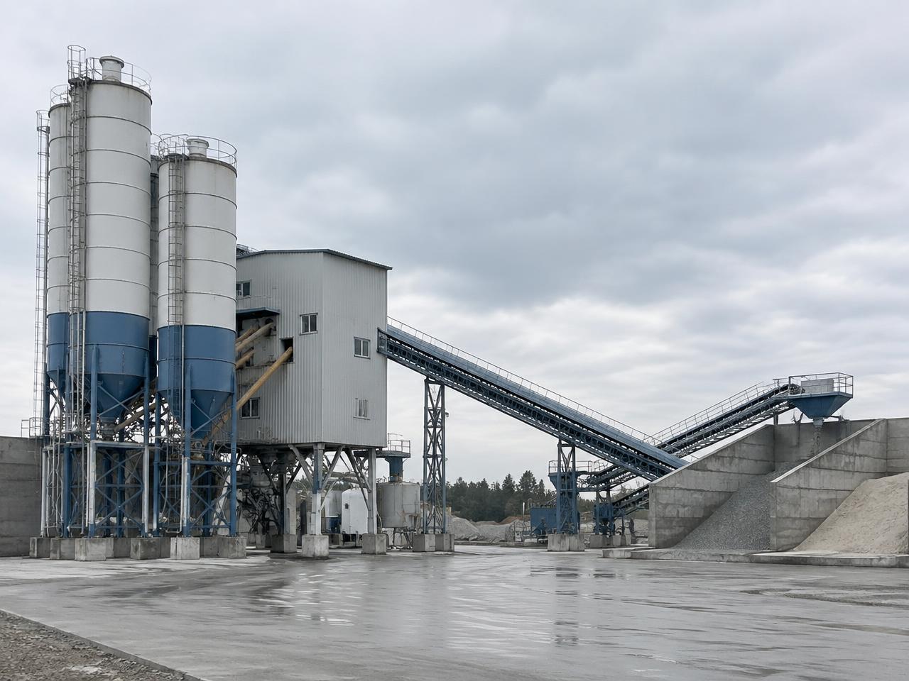 Concrete batching plant silos and conveyor line (representative image)